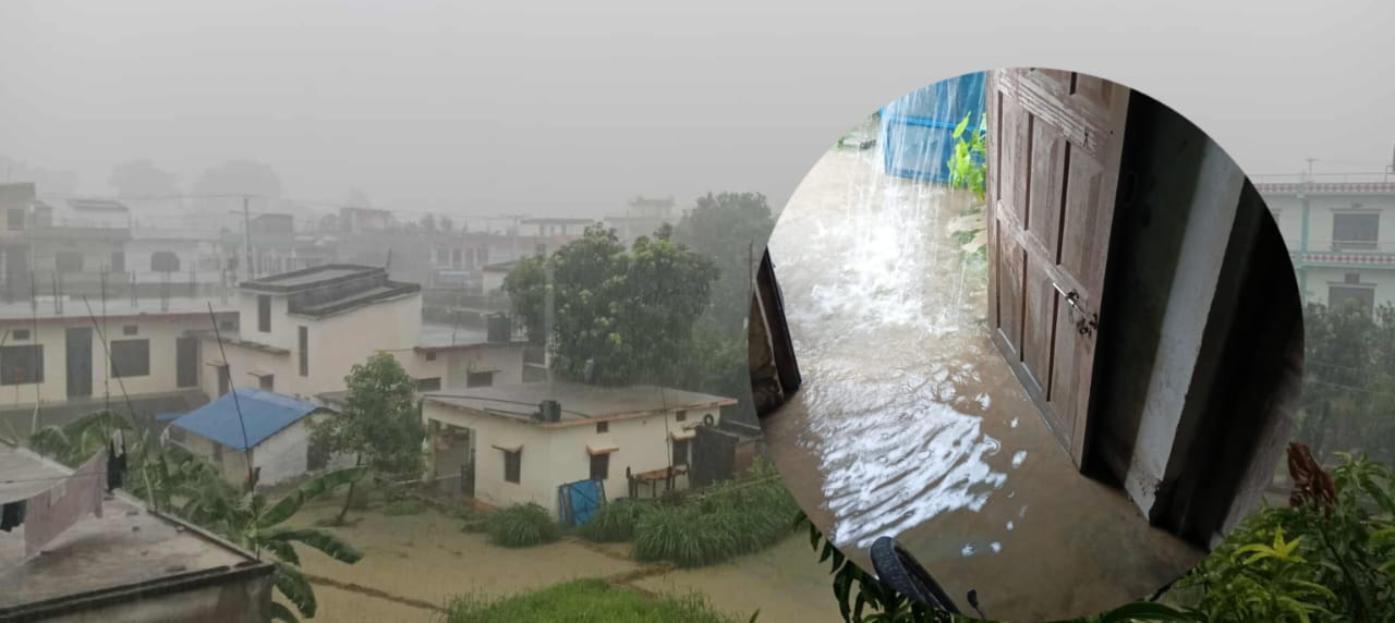 Residents navigate floodwaters in Dhangadhi, Nepal, after 202mm rainfall submerged homes and roads.