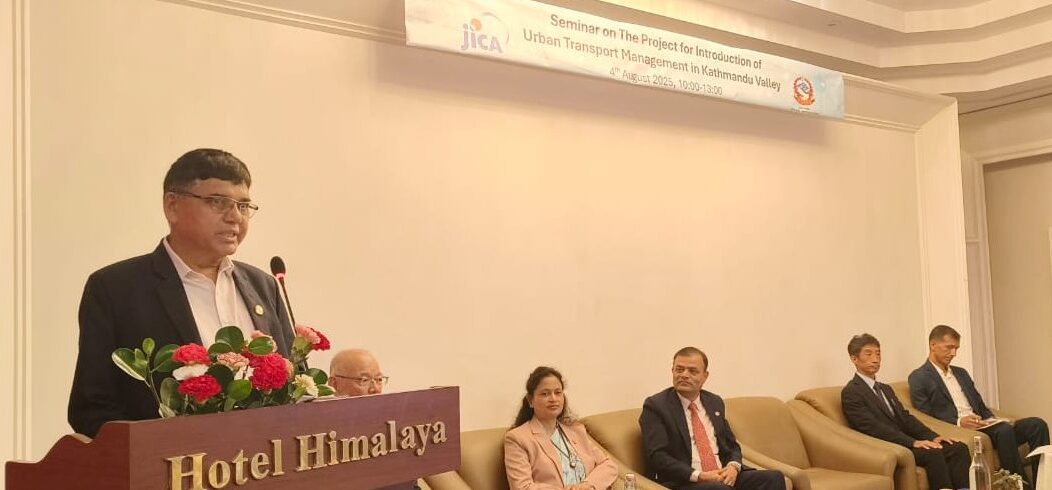 Infrastructure Minister Devendra Dahal speaking at JICA-organized traffic management study event in Lalitpur, emphasizing digital technology and inter-agency cooperation for Kathmandu Valley traffic improvement.