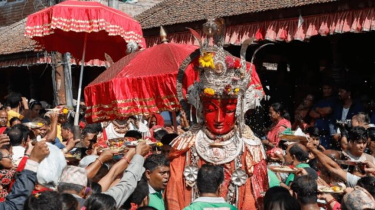 Devotees in Bhaktapur carrying images of Deepankar Buddha during the Panchadan festival procession on Bhadra Krishna Trayodashi.
