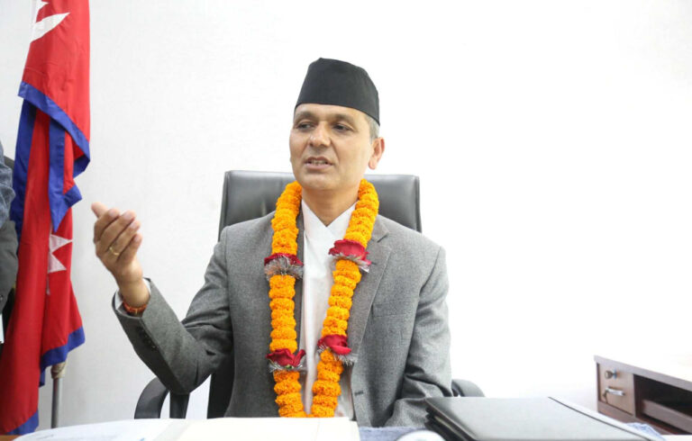 Home Minister Om Prakash Aryal addressing reporters outside Singha Durbar about corruption investigations and possible passport suspensions.