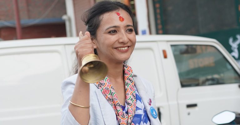 Dr. Tosima Karki speaking during a public event in Kathmandu, addressing party reform and inclusivity within the Rastriya Swatantra Party.
