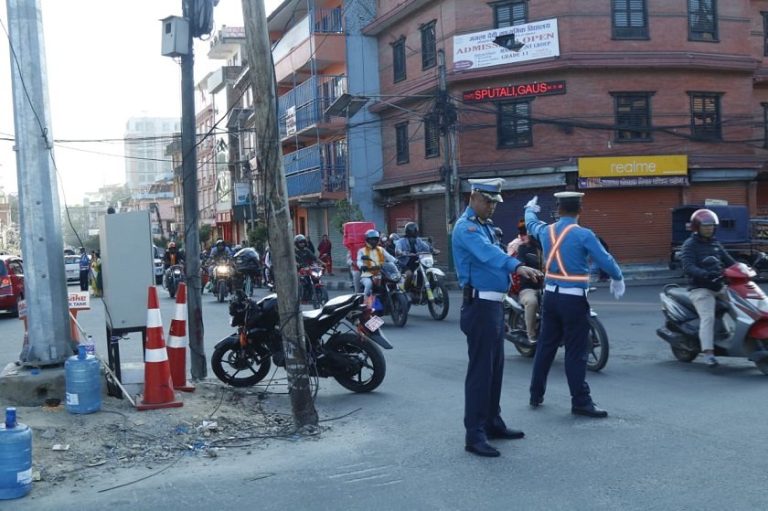 Traffic police officers manage vehicles at a busy intersection in Kathmandu during Tihar 2025, ensuring smooth movement and public safety across the festival week.