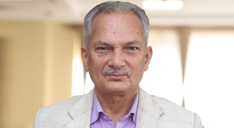 Dr. Baburam Bhattarai addressing a public event in Kathmandu, speaking about lowering the parliamentary age limit to encourage youth participation in Nepali politics.