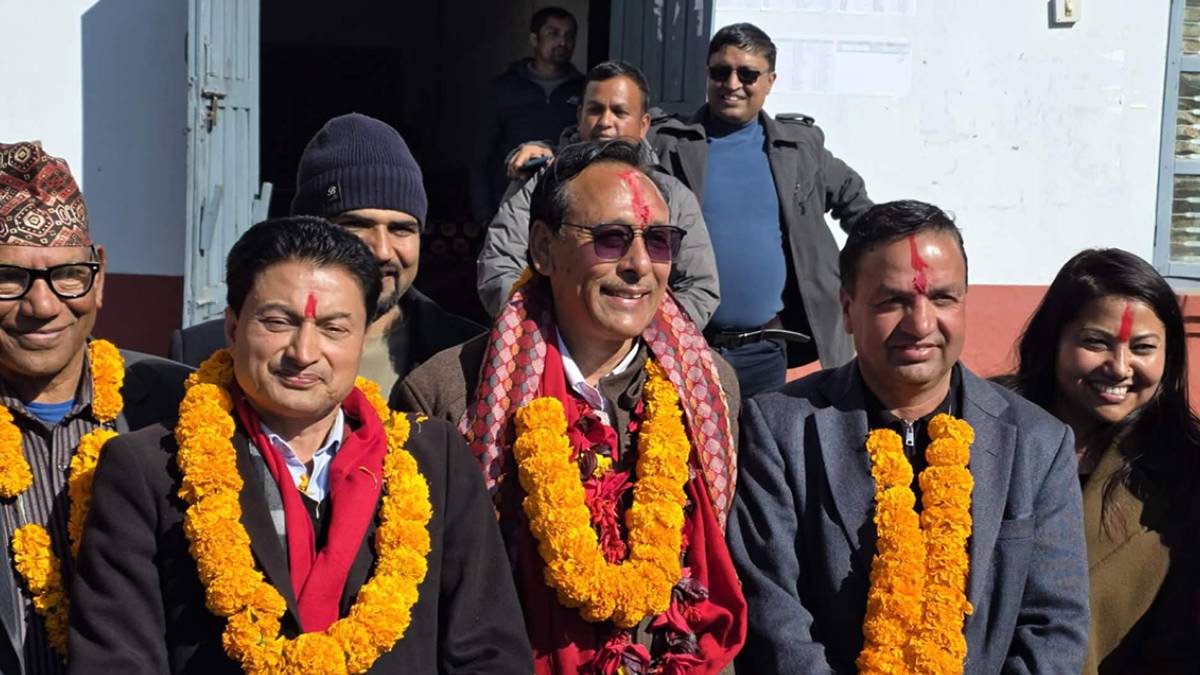 Election candidates from rival political parties exchange greetings during the nomination filing process in Gulmi ahead of the House of Representatives election.