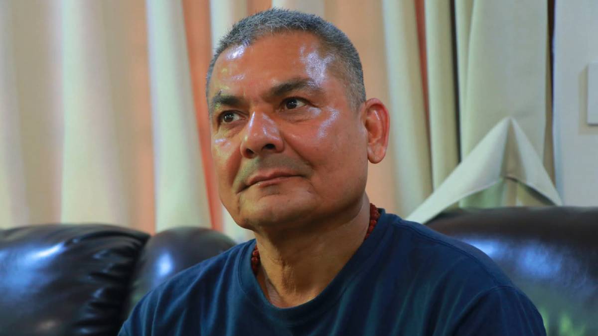 Durga Prasai being escorted by Nepal Police officers after his arrest in Pokhara over alleged misinformation targeting the Election Commission.