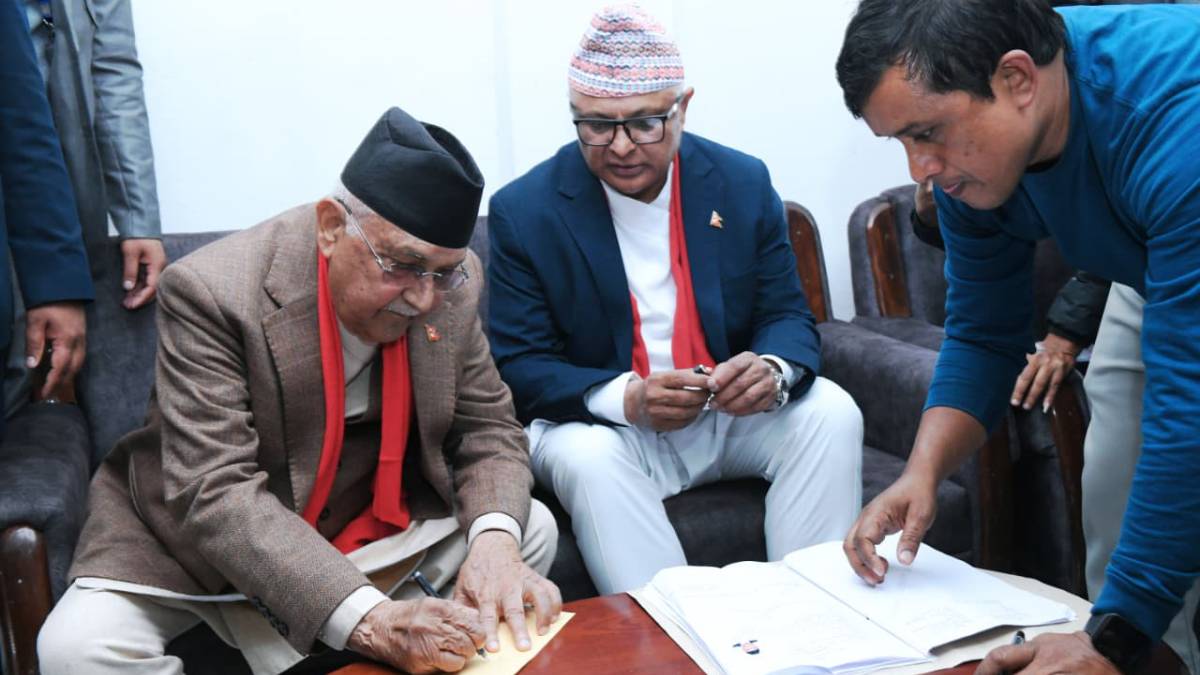 CPN-UML Chair KP Sharma Oli speaks to media after registering his candidacy from Jhapa–5 at the election officer’s office.