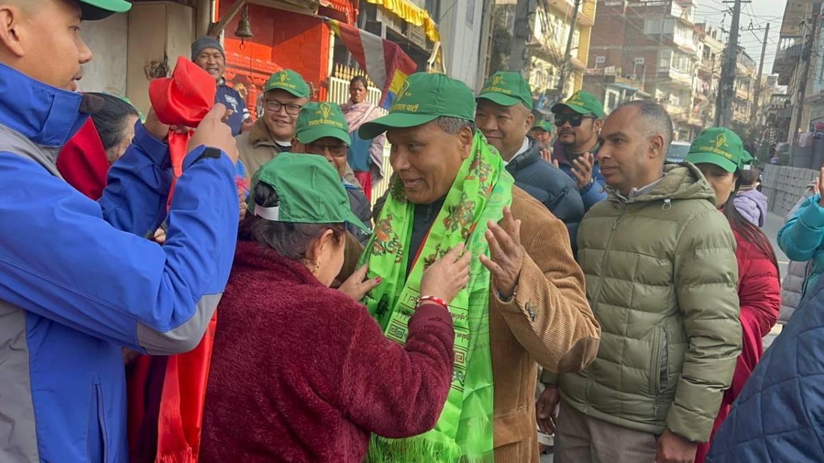 Former minister and Ujyalo Nepal Party chair Kulman Ghising interacts with local residents during a door-to-door election campaign in the Boudha area of Kathmandu.
