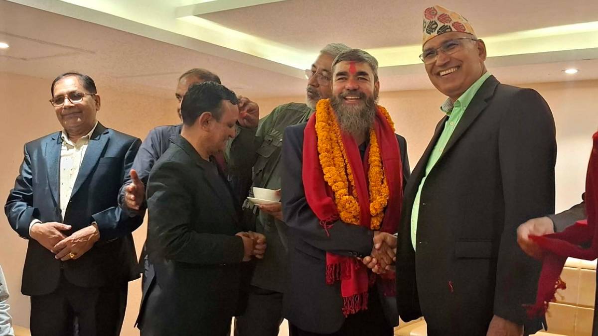 Binod Pahadi being welcomed into CPN-UML by party leaders Bishnu Paudel, Chhabilal Bishwakarma and Lila Giri during a formal event.