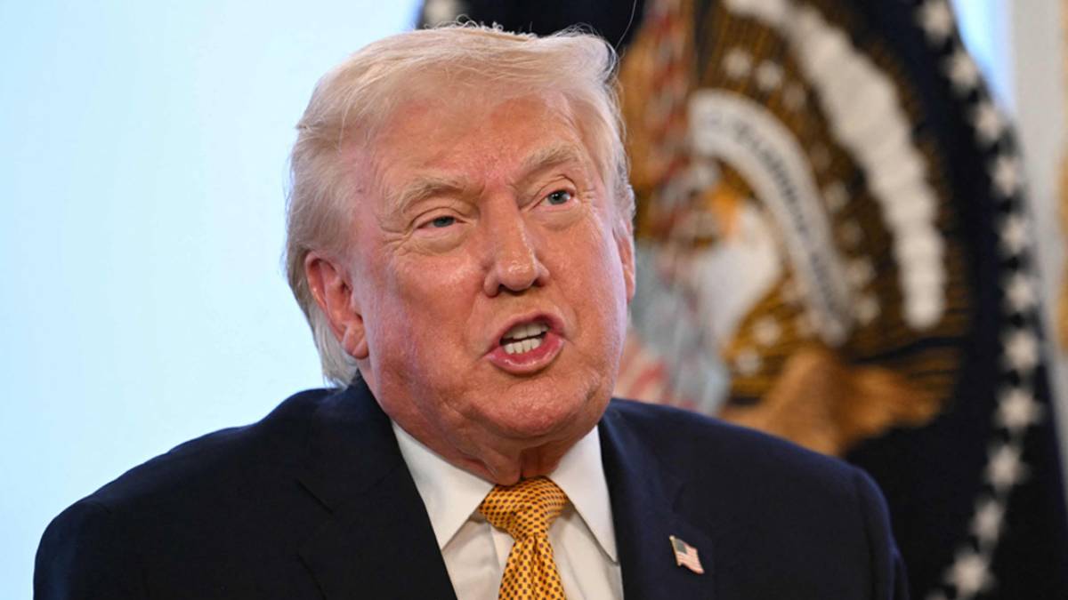 U.S. President Donald Trump speaking at a public event amid controversy over an AI-generated video