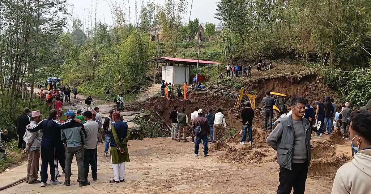Locals and officials gather as flood damages bridge in Bhojpur Nepal with road restoration work underway