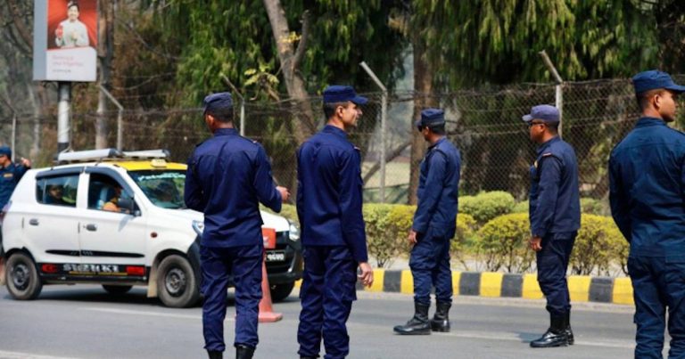 Nepal Police officers patrolling near Kathmandu Airport during harassment crackdown