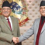 Prachanda and KP Oli shaking hands during a political meeting in Nepal file photo