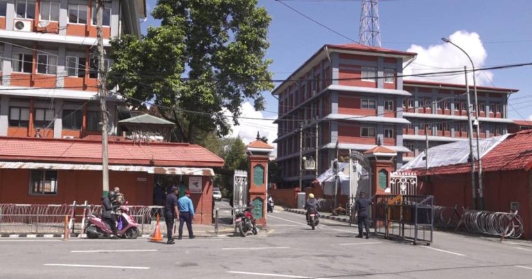 Security personnel and vehicles at Singha Durbar main gate in Kathmandu during entry regulation changes