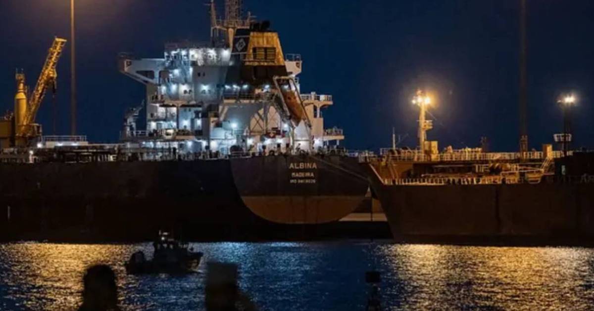 Oil tanker docked at a Gulf port at night during US blockade on Iran tensions