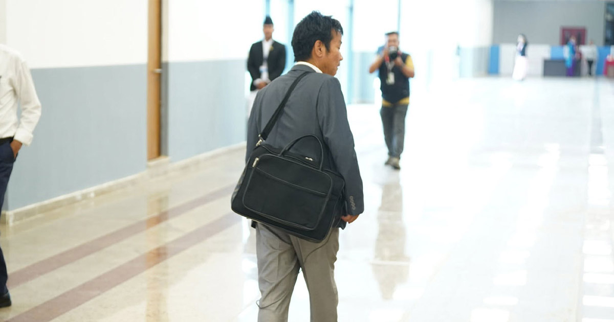 Harka Sampang leaving Parliament during protests over PM Shah’s absence