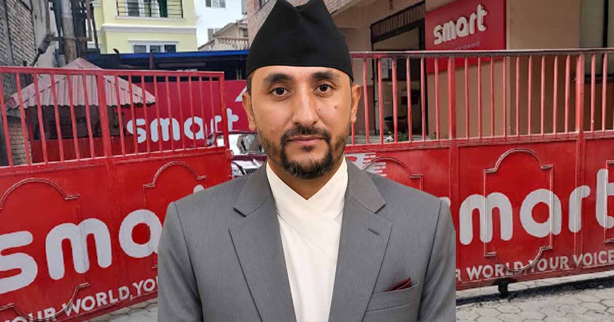 Jagadish Kharel pictured in front of the Smart Telecom office gate in Kathmandu