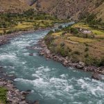 River flowing through a rural valley in Nepal amid climate change concerns
