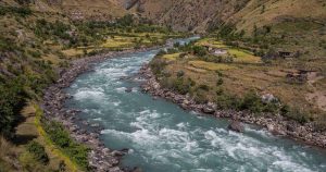 River flowing through a rural valley in Nepal amid climate change concerns