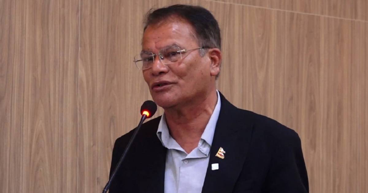 Nepali Congress spokesperson speaking at a microphone about political appointments