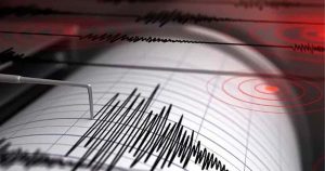 Seismograph recording earthquake activity with seismic wave patterns on a monitoring chart