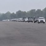 Government vehicles carrying parliamentary officials travel in a convoy in Kanchanpur