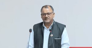 Nara Bahadur Bista addresses the National Assembly while speaking at the podium.