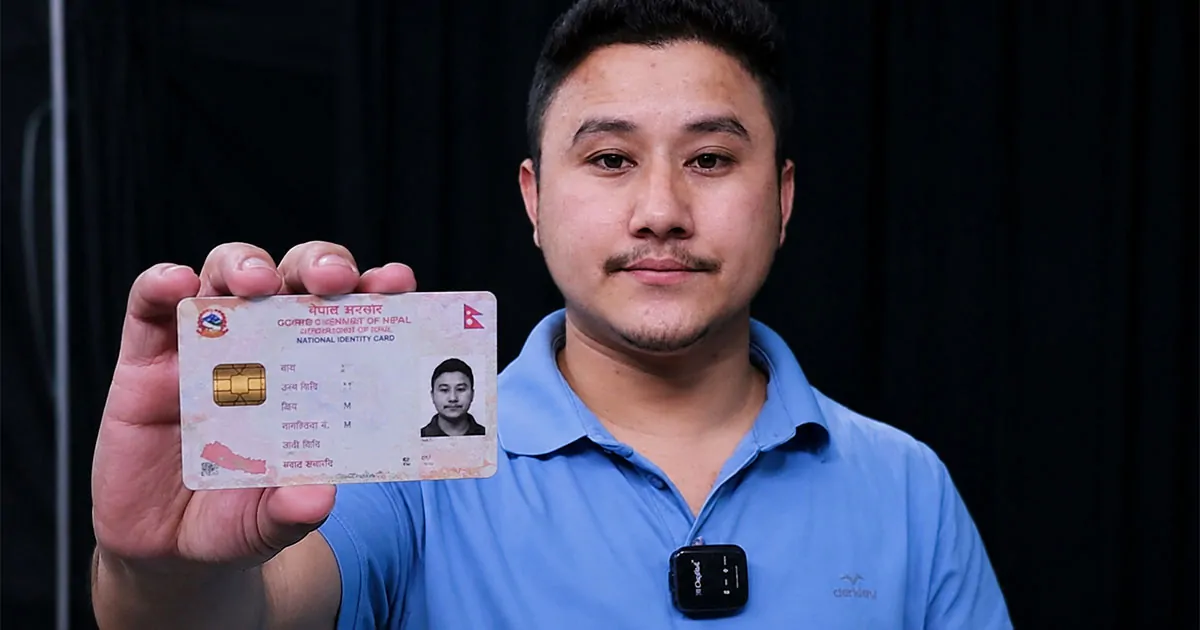 Roshan Shrestha holding a Nepal National Identity Card in his hand