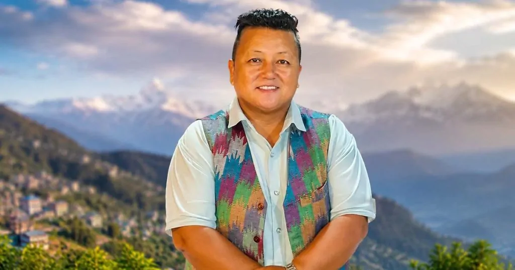 Sharin Tamang posing outdoors with a mountain landscape in the background