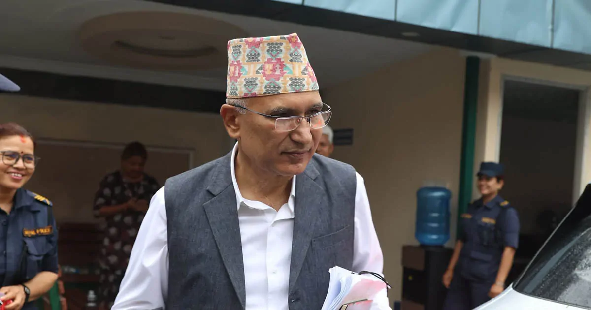 Bishnu Paudel leaving court with documents