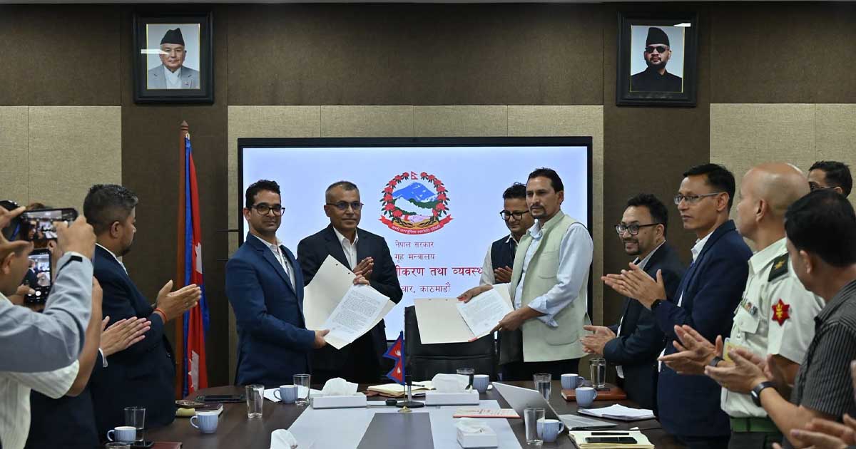 Officials display signed agreements at a Kathmandu ceremony